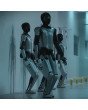 Drei MagicBot Gen2 humanoide Roboter mit schwarzem Gesichtsschutzvisier in futuristischer Innenumgebung